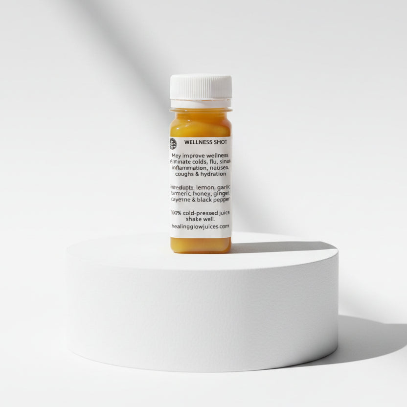 Small bottle of Wellness Shots on a reflective surface with a wooden background